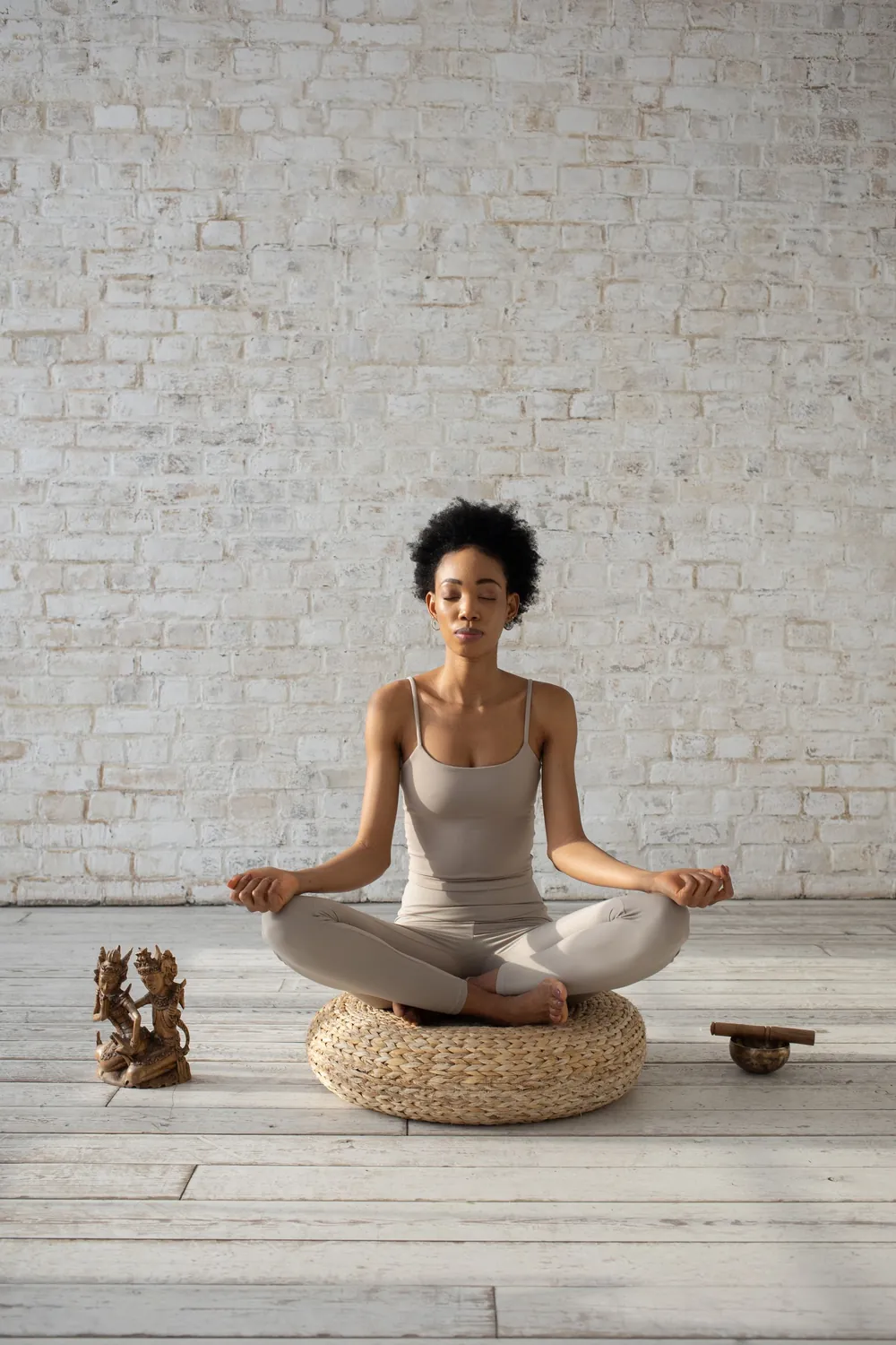 Peaceful woman meditating, representing mind and stress care